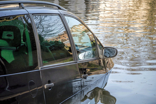 Photo of a car partially submerged in water